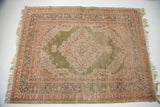 Unique green silk Turkish rug, unusual green field, central medallion, intricate floral patterns.