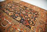 Unusual allover herati design on the walnut brown field of an antique Caucasian rug.