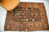 Antique Caucasian rug, allover Herati design on walnut brown field with rust border.