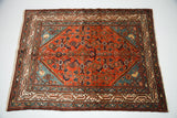 Sweet Persian Malayer rug with vibrant red field, blue corner spandrels, and allover Herati design.