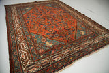 Traditional red Herati design field connects to a fantastic blue corner and patterned ivory border.