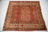 Corner of Vintage Hamadan rug, with cranberry rose Herati field and multi-colored geometric borders.