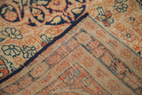 Antique Senneh Baft rug corner showing fine construction and tightly woven back in rust and blue.