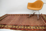 Antique Armenian rug featuring a unique diamond harlequin pattern, dark madder red and cream.