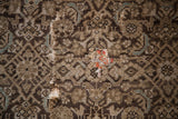 Antique Hamadan rug close-up, blanched charcoal pile, foundation wear, and red-orange repair patch.