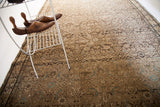 Antique Hamadan rug's herati pattern with blanched charcoal field and light blue bird motifs.