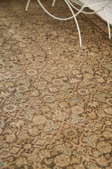 Aged texture showing blanched charcoal field with light blue Herati pattern on antique Hamadan rug.