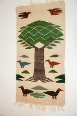 Dark duckling with green foliage and natural fringe on Romanian pictorial kilim.