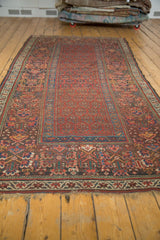 Hand-knotted antique Kurdish rug fringe with red, blue, cream border motifs.