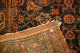 Edge of circa 1920 Persian Hamadan rug, dark blue Herati design, foundation, W. & J. Sloan binding.