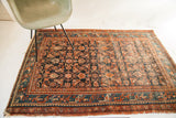 Vintage Persian Hamadan rug, dark blue Herati motif, teal border, aged texture, 4'3
