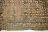 Antique Caucasian rug's tattered edge, classic serrated leaf border, and geometric field.