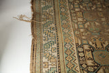 Antique Caucasian runner's frayed end, displaying teal, tan, brown geometric serrated leaf border.