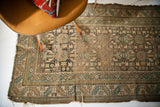 Antique Caucasian runner with faded teal and earthy geometric patterns, serrated leaf border, 3'4