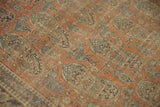 Close-up of ultra fine weave and blue paisley boteh motifs on rust ground of antique Kashan.