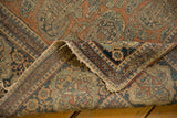 Antique Kashan rug detail: intricate Mohtashem border, rust paisley field, silk selvage.