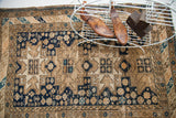 Fine weave antique Caucasian rug with geometric animal and medallion designs, indigo and beige.