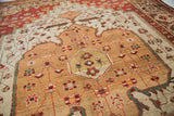 Vintage hand-knotted Josan Sarouk with rhubarb spandrels, sand field, and teal, copper floral motifs.
