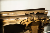 Distressed gold gilt and ornate carving detail on the antique Victorian frame corner.