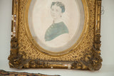 Antique gold gilt frame with ornate carvings and distressed finish at lower right.