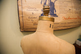 Vintage JR Bauman dress form's adjustable shoulder, gold finial, and neck number 11.