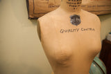 JR Bauman dress form chest with Quality Control stencil and Normal Modelform emblem.