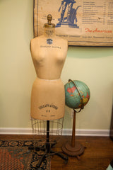 Vintage JR Bauman dress form: 'COLLAPS-A-FORM 11 MODEL 1966' label, black wheeled base.