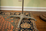 Textured grey metal stand base with splayed legs for the Mid Century Dress Form.
