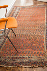 Antique Persian Serbend runner showing madder red boteh field, traditional geometric borders, and aged fringe.