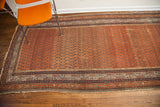 Antique Persian Serbend runner, madder root red field, allover boteh pattern, and traditional borders.
