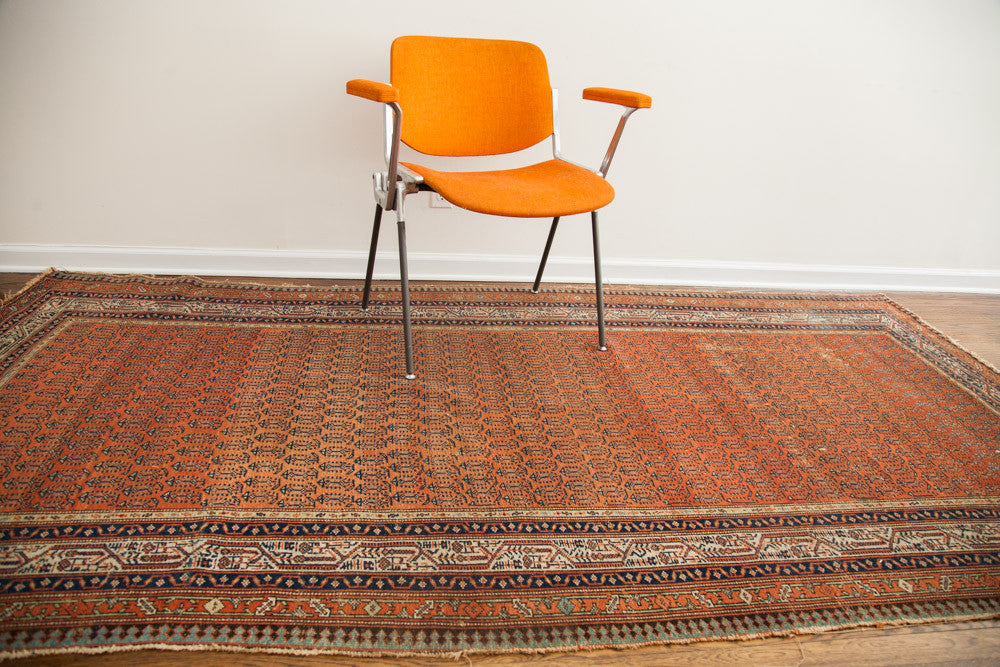 Antique Persian Serbend hand-knotted runner, madder root red rust boteh field, deep blue borders.