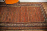 Antique Persian Serbend runner: madder root red field with dark boteh design and geometric border.