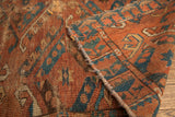 Worn texture, distinct blue guls with hooks on antique Beshir rug.