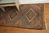 Rich abrash blues and deep orange geometric patterns on an antique Beshir runner.