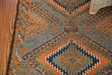 Intricate geometric patterns on an antique Beshir runner, with rust, walnut, and abrash blues.