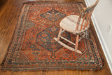 Antique Tribal Persian Shiraz rug, deep red field, dark blue double medallion, serrated leaf designs.