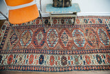 Collector antique Kazak runner, showcasing intricate geometric patterns and varied hues.