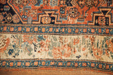 Antique Bijar rug detail: rust herati field and European floral border with peach and blue tones.