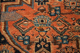 Antique Bijar rug with traditional Herati geometric motifs in terracotta, blue, and brown.