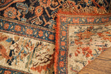 Antique Bijar rug corner with reverse showing color migration, orange fringe, and rich patterns.