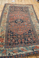 Antique Bijar rug detail showing indigo Herati field and European inspired floral border.