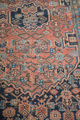 Antique Bijar rug showing Persian herati field and curvilinear European-style border.