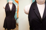 Black vintage 90s Betsey Johnson halter dress with satin lapels and full button front.