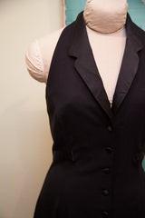 Black Betsey Johnson dress with sophisticated lapel collar and front buttons.