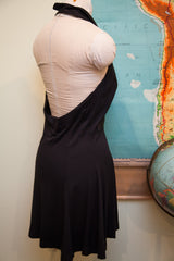 Low-cut back and flared short skirt of the vintage black Betsey Johnson dress.