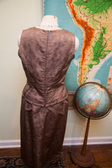 Back view of vintage 60s Asian dress, subtle brown leaf pattern, zipped waist detail.