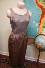 Vintage 60s Asian inspired dress with patterned brown skirt and delicate floral motifs.