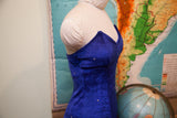 Deep blue velvet 80s dress bodice with pointed shape and tiny rhinestones.