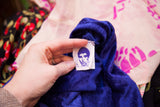 Betsey Johnson Punk label with blue face on a vibrant blue velvet vintage dress.