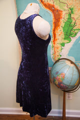 Side profile of a vintage Betsey Johnson dress in deep purple crushed velvet.